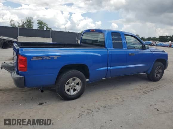 2008 Dodge Dakota SXT с VIN 1D7HE32K98S553868, выставлен на аукционе Copart как лот 61447275 с пробегом 133 549 миль миль и Списание • Salvage title. История ставок и продаж доступна на DreamBid. Изображение 3.