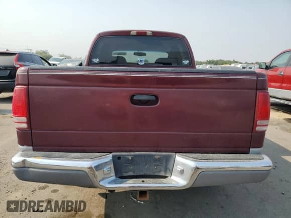 2000 Dodge Dakota Sport с VIN 1B7GG2AN1YS699073, выставлен на аукционе Copart как лот 70782284 с пробегом 141 876 миль миль и Списание • Salvage title. История ставок и продаж доступна на DreamBid. Изображение 6.