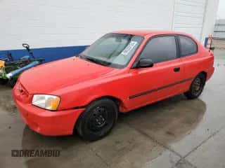 2000 Hyundai Accent z VIN KMHCF35G2YU013092, wystawiony jako Copart lot #86220124 z przebiegiem 153 844 mil mil oraz Szkoda całkowita • Salvage title. Historia ofert i sprzedaży dostępna na DreamBid. Obrazek 1.