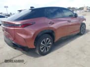 ✅ 2024 Lexus RZ 450e Premium • VIN: JTJAAAAB0RA024522 • Lot: 41640154. Listed on IAAI with 8,851 mi. Free auction sales archive from the USA and detailed vehicle history report at DreamBid. Image 4.