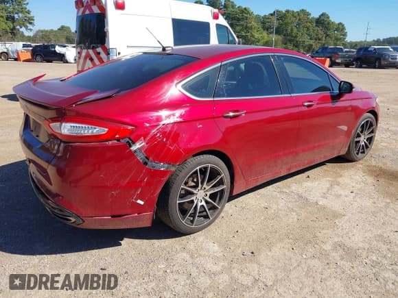 ✅ 2014 Ford Fusion Titanium • VIN: 3FA6P0K93ER176040 • Lot: 43483970. Listed on IAAI with 185,535 mi. Free auction sales archive from the USA and detailed vehicle history report at DreamBid. Image 4.