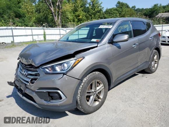 ✅ 2018 Hyundai Santa Fe 2.4L • VIN: 5XYZTDLBXJG560557 • Лот: 67072293. Опубликован ранее на Copart с пробегом 105 339 миль. Бесплатный доступ к архиву аукционных продаж из США и подробный отчёт об истории автомобиля на DreamBid. Изображение 1.