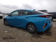 ✅ 2021 Toyota Prius LE • VIN: JTDKAMFP7M3180339 • Лот: 86526555. Опубликован ранее на Copart с пробегом 12 083 миль. Бесплатный доступ к архиву аукционных продаж из США и подробный отчёт об истории автомобиля на DreamBid. Изображение 2.