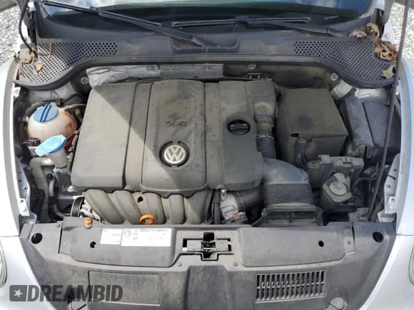 ✅ 2012 Volkswagen Beetle Entry • VIN: 3VWFP7AT0CM615654 • Lot: 69775265. Listed on Copart with 87,013 mi. Free auction sales archive from the USA and detailed vehicle history report at DreamBid. Image 11.