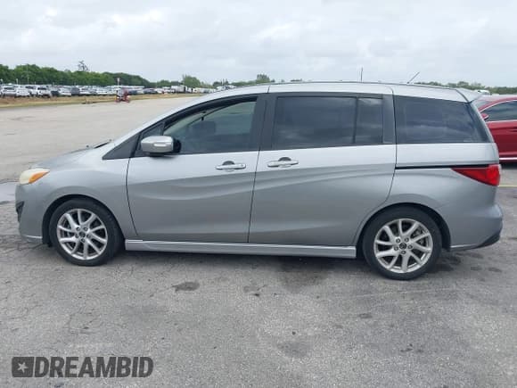 ✅ 2013 Mazda 5 Touring • VIN: JM1CW2CL5D0160104 • Lot: 41722470. Listed on IAAI with 135,708 mi. Free auction sales archive from the USA and detailed vehicle history report at DreamBid. Image 14.