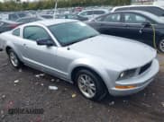 ✅ 2007 Ford Mustang Deluxe • VIN: 1ZVHT80N475318704 • Lot: 43537578. Listed on IAAI with 156,054 mi. Free auction sales archive from the USA and detailed vehicle history report at DreamBid. Image 1.