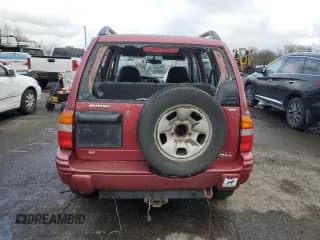 ✅ 2000 Suzuki Vitara JX • VIN: 2S3TD52V9Y6100173 • Лот: 86200824. Опубликован ранее на Copart с пробегом Не указан. Бесплатный доступ к архиву аукционных продаж из США и подробный отчёт об истории автомобиля на DreamBid. Изображение 6.