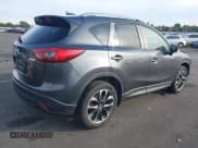 ✅ 2016 Mazda CX-5 Grand Touring • VIN: JM3KE4DY4G0880137 • Lot: 43516086. Wystawiony na IAAI z przebiegiem 135 661 mil. Bezpłatny archiwum sprzedaży aukcyjnych z USA i szczegółowy raport historii pojazdu na DreamBid. Zdjęcie 4.