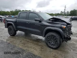 ✅ 2023 Chevrolet Colorado 4WD Trail Boss • VIN: 1GCPTEEKXP1260763 • Лот: 65988034. Опубликован ранее на Copart с пробегом 15 285 миль. Бесплатный доступ к архиву аукционных продаж из США и подробный отчёт об истории автомобиля на DreamBid. Изображение 4.