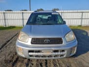 ✅ 2003 Toyota RAV4 • VIN: JTEGH20V830107215 • Лот: 94493765. Опубликован ранее на Copart с пробегом 252 429 миль. Бесплатный доступ к архиву аукционных продаж из США и подробный отчёт об истории автомобиля на DreamBid. Изображение 5.