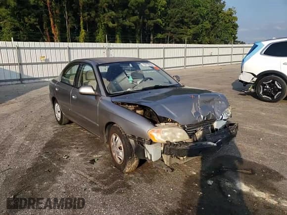 ✅ 2003 Kia Spectra • VIN: NCS100756 • Lot: 72712434. Wystawiony na Copart z przebiegiem 50 162 mil. Bezpłatny archiwum sprzedaży aukcyjnych z USA i szczegółowy raport historii pojazdu na DreamBid. Zdjęcie 11.