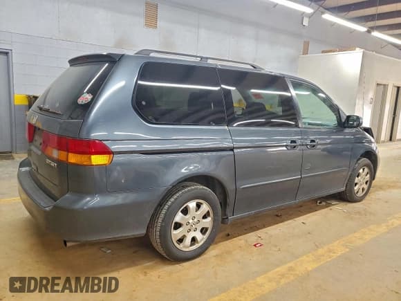 ✅ 2004 Honda Odyssey EX • VIN: 5FNRL18694B062307 • Lot: 93818955. Listed on Copart with Not provided. Free auction sales archive from the USA and detailed vehicle history report at DreamBid. Image 3.