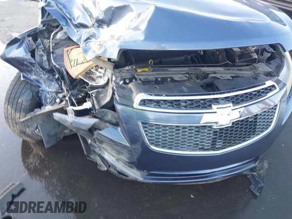 ✅ 2014 Chevrolet Cruze LS • VIN: 1G1PA5SHXE7464206 • Lot: 43599999. Listed on IAAI with 130,122 mi. Free auction sales archive from the USA and detailed vehicle history report at DreamBid. Image 19.