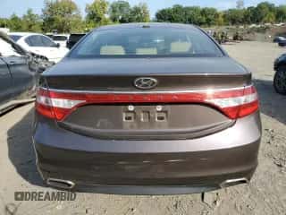 2015 Hyundai Azera z VIN KMHFG4JG5FA476297, wystawiony jako Copart lot #72401584 z przebiegiem 61 484 mil mil oraz Szkoda całkowita • Salvage title. Historia ofert i sprzedaży dostępna na DreamBid. Obrazek 6.
