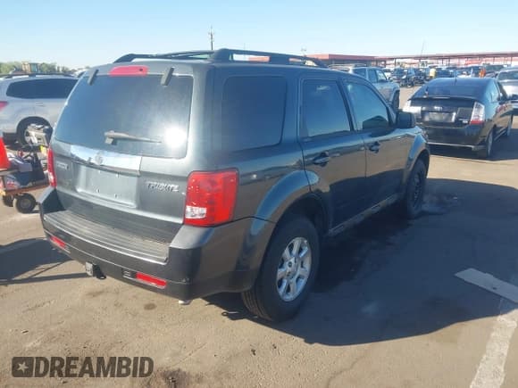 ✅ 2009 Mazda Tribute • VIN: 4F2CZ06G79KM04129 • Lot: 40843930. Listed on IAAI with 164,731 mi. Free auction sales archive from the USA and detailed vehicle history report at DreamBid. Image 4.