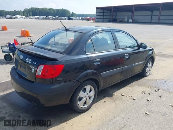 ✅ 2009 Kia Rio LX • VIN: KNADE223496504192 • Lot: 42647197. Listed on IAAI with 131,710 mi. Free auction sales archive from the USA and detailed vehicle history report at DreamBid. Image 4.