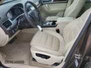 ✅ 2012 Volkswagen Touareg Sport • VIN: WVGFK9BP8CD002347 • Lot: 87015785. Listed on Copart with 127,068 mi. Free auction sales archive from the USA and detailed vehicle history report at DreamBid. Image 7.