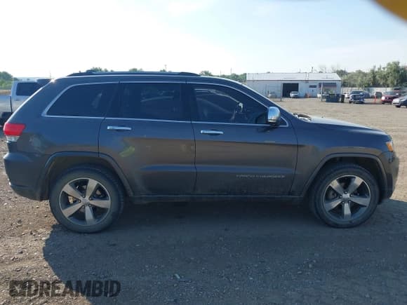 ✅ 2014 Jeep Grand Cherokee Overland • VIN: 1C4RJFCG2EC572628 • Lot: 42874326. Listed on IAAI with 129,145 mi. Free auction sales archive from the USA and detailed vehicle history report at DreamBid. Image 13.