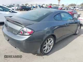 2007 Hyundai Tiburon GT z VIN KMHHN66F37U251290, wystawiony jako IAAI lot #41355889 z przebiegiem 135 374 mil mil oraz . Historia ofert i sprzedaży dostępna na DreamBid. Obrazek 4.