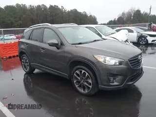 ✅ 2016 Mazda CX-5 Grand Touring • VIN: JM3KE4DY9G0894454 • Lot: 43871047. Wystawiony na IAAI z przebiegiem 186 153 mil. Bezpłatny archiwum sprzedaży aukcyjnych z USA i szczegółowy raport historii pojazdu na DreamBid. Zdjęcie 1.