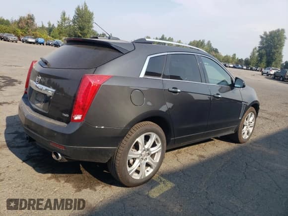 ✅ 2015 Cadillac SRX Premium Collection • VIN: 3GYFNGE38FS598583 • Лот: 70913325. Опубликован ранее на Copart с пробегом 121 230 миль. Бесплатный доступ к архиву аукционных продаж из США и подробный отчёт об истории автомобиля на DreamBid. Изображение 3.