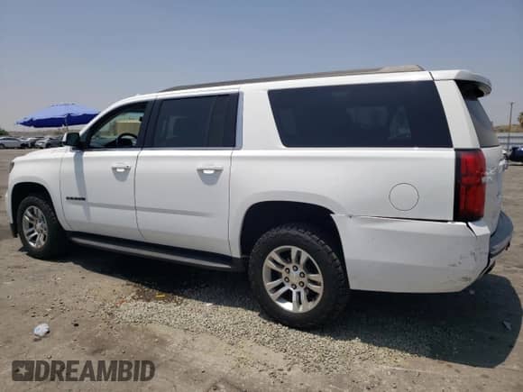 2019 Chevrolet Suburban LT with VIN 1GNSCHKCXKR207233, listed as a Copart auction lot 55410464 with 107,500 mi miles and Salvage title. Bid and sale history available at DreamBid. Image 2.