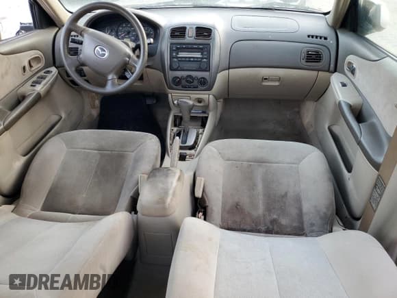 ✅ 2001 Mazda Protege LX • VIN: JM1BJ225310467814 • Lot: 77675414. Listed on Copart with Not provided. Free auction sales archive from the USA and detailed vehicle history report at DreamBid. Image 8.