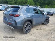 ✅ 2025 Mazda CX-50 Premium • VIN: 7MMVABDYXSN326134 • Лот: 69367495. Опубликован ранее на Copart с пробегом Не указан. Бесплатный доступ к архиву аукционных продаж из США и подробный отчёт об истории автомобиля на DreamBid. Изображение 3.