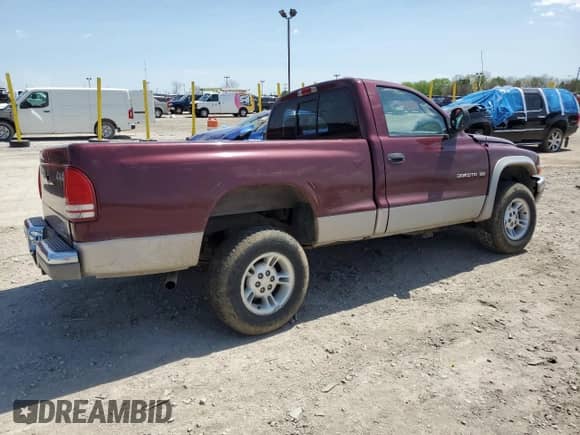 2000 Dodge Dakota Sport z VIN 1B7GG26N5YS546673, wystawiony jako Copart lot #54512715 z przebiegiem 140 904 mil mil oraz Czysty tytuł • Clean title. Historia ofert i sprzedaży dostępna na DreamBid. Obrazek 3.