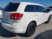 2015 Dodge Journey American Value z VIN 3C4PDCAB0FT540285, wystawiony jako IAAI lot #43610721 z przebiegiem 208 916 mil mil oraz . Historia ofert i sprzedaży dostępna na DreamBid. Obrazek 4.