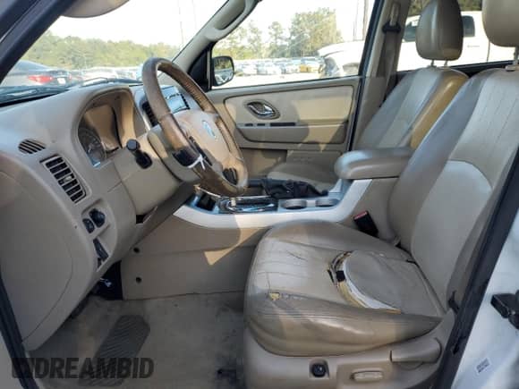 2006 Mercury Mariner Luxury с VIN 4M2CU56176DJ03331, выставлен на аукционе Copart как лот 83557274 с пробегом 291 468 миль миль и Списание • Salvage title. История ставок и продаж доступна на DreamBid. Изображение 7.