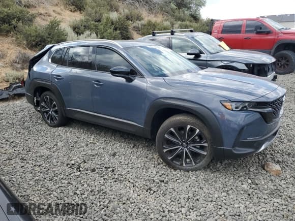 ✅ 2024 Mazda CX-50 Meridian Edition • VIN: 7MMVABDY4RN223835 • Lot: 62947744. Listed on Copart with 1,048 mi. Free auction sales archive from the USA and detailed vehicle history report at DreamBid. Image 4.