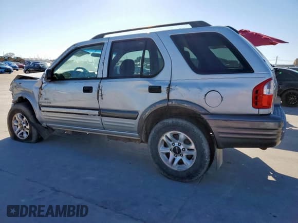 ✅ 2003 Isuzu Rodeo • VIN: 4S2CK58WX34304001 • Lot: 41642505. Listed on Copart with 155,579 mi. Free auction sales archive from the USA and detailed vehicle history report at DreamBid. Image 2.