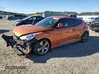 ✅ 2015 Hyundai Veloster Turbo • VIN: KMHTC6AEXFU231938 • Lot: 82463665. Listed on Copart with 200,795 mi. Free auction sales archive from the USA and detailed vehicle history report at DreamBid. Image 1.