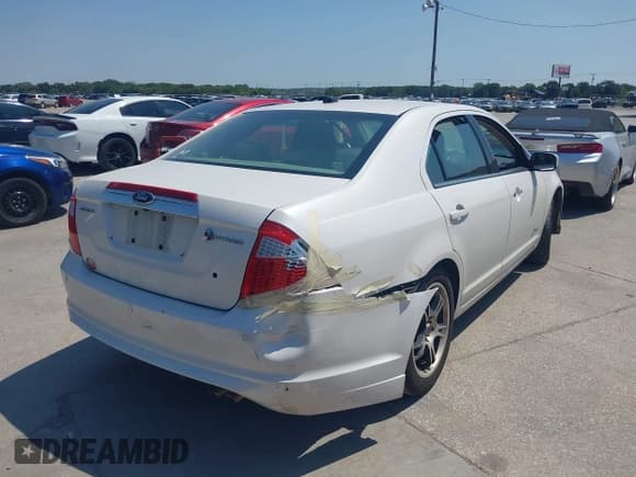 ✅ 2010 Ford Fusion Hybrid • VIN: 3FADP0L3XAR185989 • Lot: 43156692. Listed on IAAI with 226,637 mi. Free auction sales archive from the USA and detailed vehicle history report at DreamBid. Image 4.