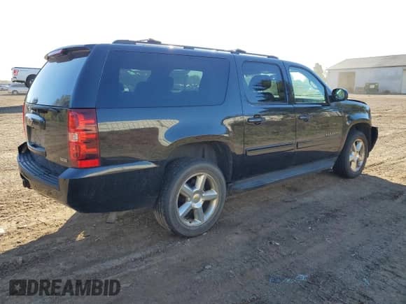 2011 Chevrolet Suburban LS with VIN 1GNSKHE34BR180335, listed as a Copart auction lot 82379145 with 259,352 mi miles and Clean title. Bid and sale history available at DreamBid. Image 3.