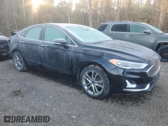 ✅ 2020 Ford Fusion Titanium • VIN: 3FA6P0RU6LR157165 • Лот: 90013925. Опубликован ранее на Copart с пробегом 124 589 миль. Бесплатный доступ к архиву аукционных продаж из США и подробный отчёт об истории автомобиля на DreamBid. Изображение 4.