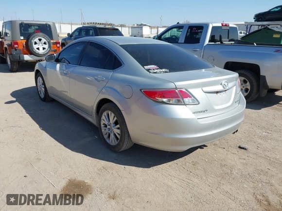 ✅ 2009 Mazda 6 i Touring • VIN: 1YVHP82A795M31562 • Lot: 41970484. Listed on IAAI with 128,724 mi. Free auction sales archive from the USA and detailed vehicle history report at DreamBid. Image 3.
