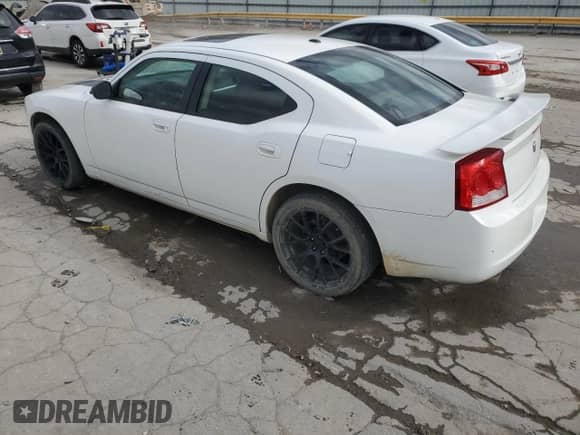 2009 Dodge Charger SXT с VIN 2B3KA33V69H576152, выставлен на аукционе Copart как лот 82020014 с пробегом 129 304 миль миль и Списание • Salvage title. История ставок и продаж доступна на DreamBid. Изображение 2.