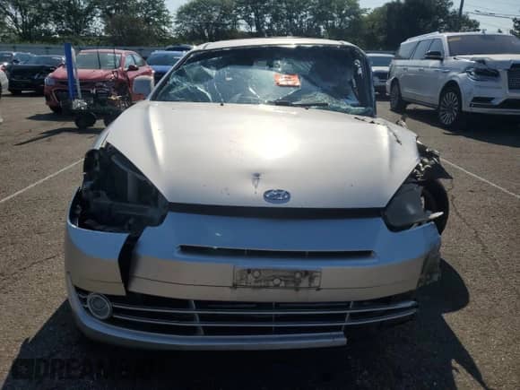2008 Hyundai Tiburon GT z VIN KMHHN66F08U267030, wystawiony jako Copart lot #67479764 z przebiegiem Nie podano mil oraz Szkoda całkowita • Salvage title. Historia ofert i sprzedaży dostępna na DreamBid. Obrazek 5.