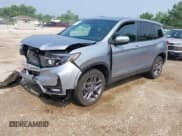 ✅ 2023 Honda Passport EX-L • VIN: 5FNYF8H50PB019594 • Lot: 42882366. Listed on IAAI with 26,120 mi. Free auction sales archive from the USA and detailed vehicle history report at DreamBid. Image 2.