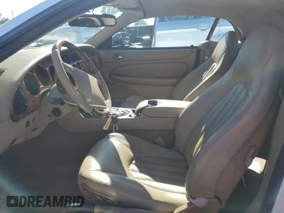 ✅ 1997 Jaguar XK • VIN: SAJGX2741VC013362 • Lot: 90138725. Wystawiony na Copart z przebiegiem 80 317 mil. Bezpłatny archiwum sprzedaży aukcyjnych z USA i szczegółowy raport historii pojazdu na DreamBid. Zdjęcie 7.