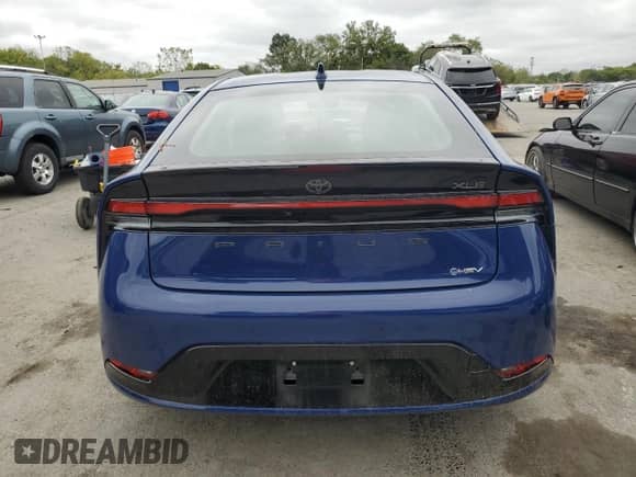 2024 Toyota Prius LE с VIN JTDADABU8R3014173, выставлен на аукционе Copart как лот 72055075 с пробегом Не указан миль и Списание • Salvage title. История ставок и продаж доступна на DreamBid. Изображение 6.