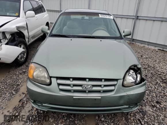 2003 Hyundai Accent GL with VIN KMHCG35C23U264701, listed as a Copart auction lot 80029154 with 142,090 mi miles and Salvage title. Bid and sale history available at DreamBid. Image 5.