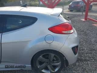 2014 Hyundai Veloster Turbo with VIN KMHTC6AE9EU189356, listed as a IAAI auction lot 43529684 with 96,297 mi miles and . Bid and sale history available at DreamBid. Image 6.