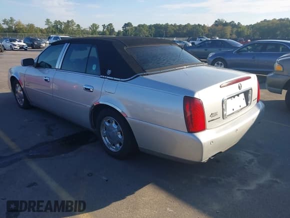 ✅ 2001 Cadillac DeVille • VIN: 1G6KD57Y81U209375 • Lot: 43263431. Listed on IAAI with 157,106 mi. Free auction sales archive from the USA and detailed vehicle history report at DreamBid. Image 3.