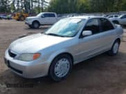 ✅ 2002 Mazda Protege DX • VIN: JM1BJ225421589304 • Lot: 43539423. Wystawiony na IAAI z przebiegiem 176 182 mil. Bezpłatny archiwum sprzedaży aukcyjnych z USA i szczegółowy raport historii pojazdu na DreamBid. Zdjęcie 2.