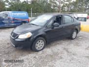 ✅ 2013 Suzuki SX4 LE • VIN: JS2YC5A31D6102366 • Lot: 43660138. Wystawiony na IAAI z przebiegiem 117 339 mil. Bezpłatny archiwum sprzedaży aukcyjnych z USA i szczegółowy raport historii pojazdu na DreamBid. Zdjęcie 2.