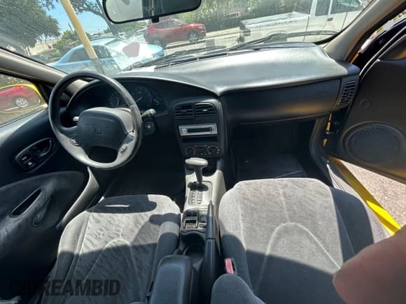 ✅ 2001 Saturn SC • VIN: 1G8ZY12771Z105142 • Лот: 67220545. Опубликован ранее на Copart с пробегом 166 396 миль. Бесплатный доступ к архиву аукционных продаж из США и подробный отчёт об истории автомобиля на DreamBid. Изображение 9.