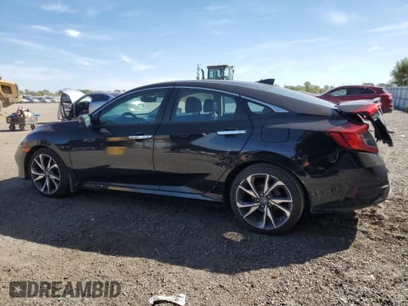 ✅ 2020 Honda Civic Touring • VIN: 2HGFC1F96LH104264 • Lot: 84596585. Listed on Copart with 131,619 mi. Free auction sales archive from the USA and detailed vehicle history report at DreamBid. Image 2.